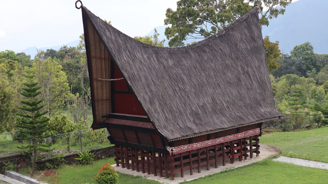 A traditional Batak house with a curved roof