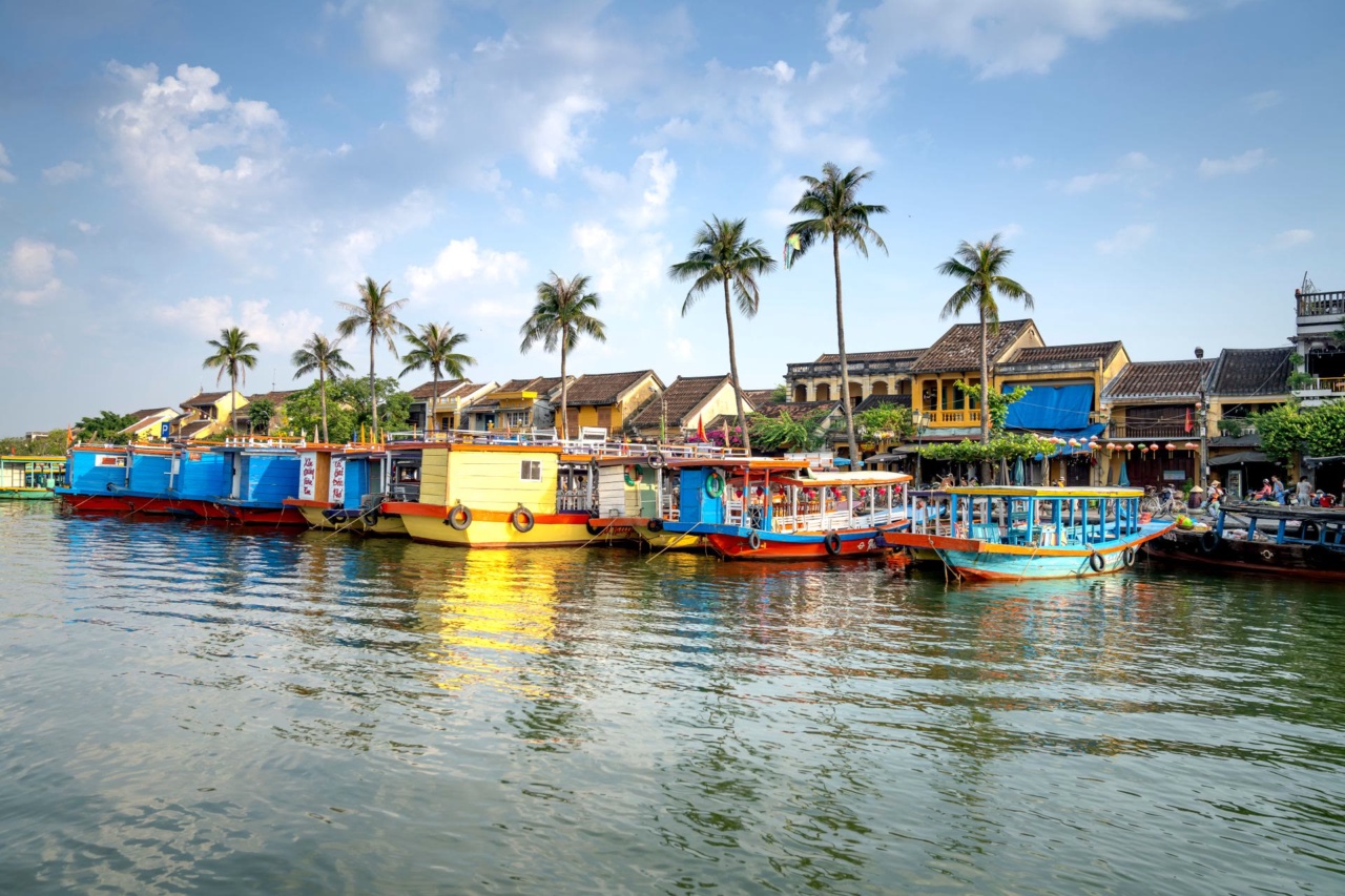 Colorful boats moored on the Thu Bon River in Hoi An