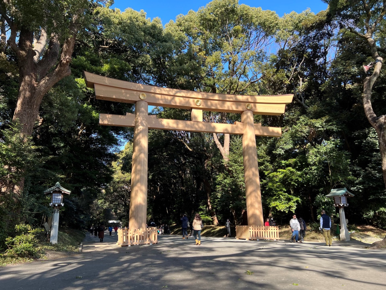 A large wooden torii gate on the approach to Meiji Shrine