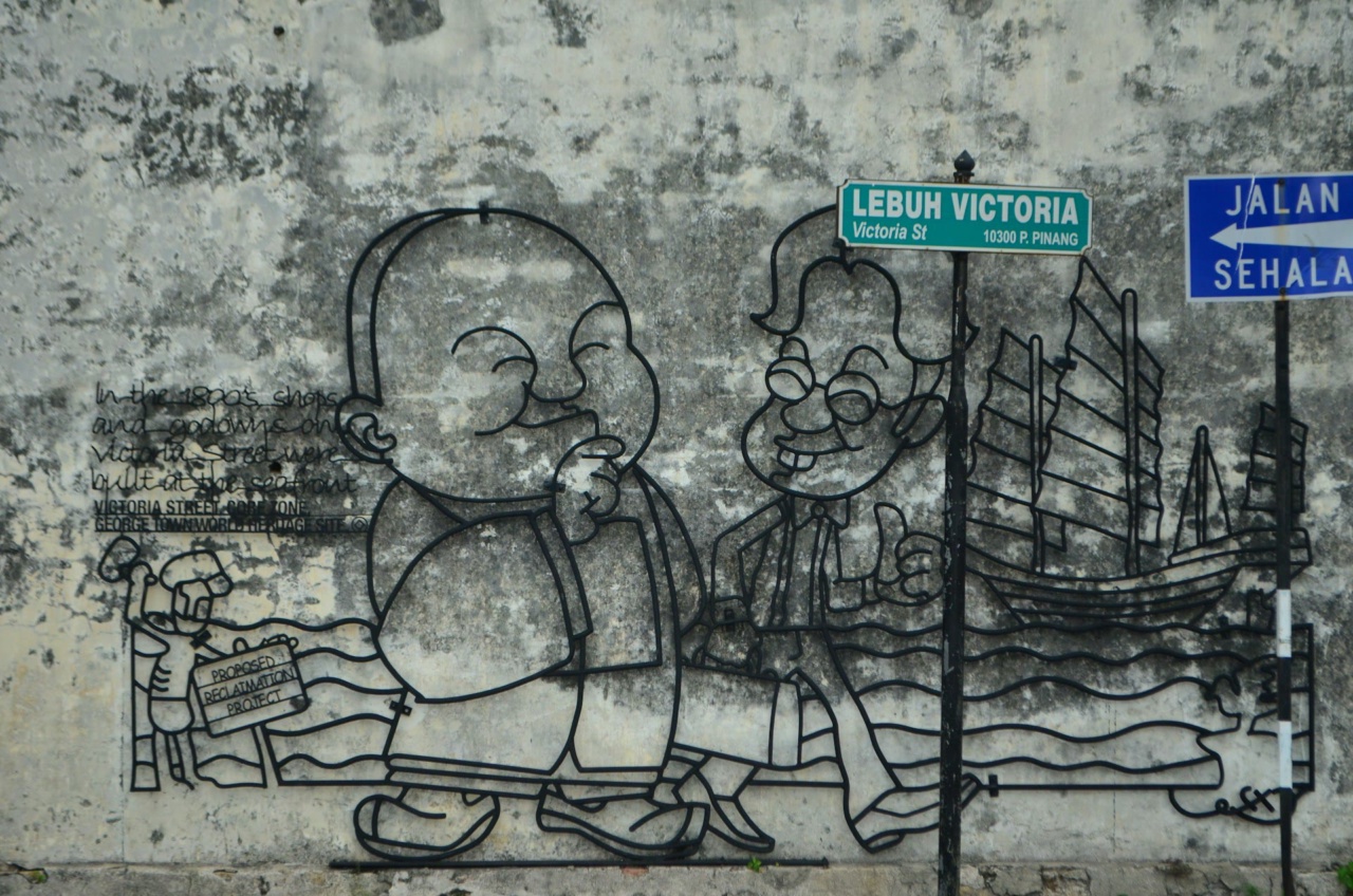 A caricature made of steel rods on a wall in George Town