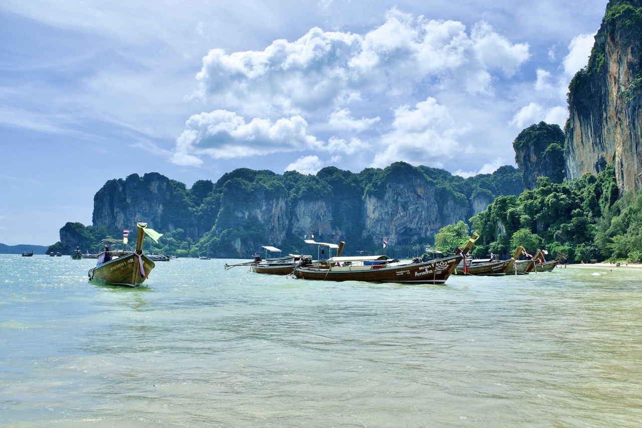 Longtail boats on turquoise water off Railay Beach