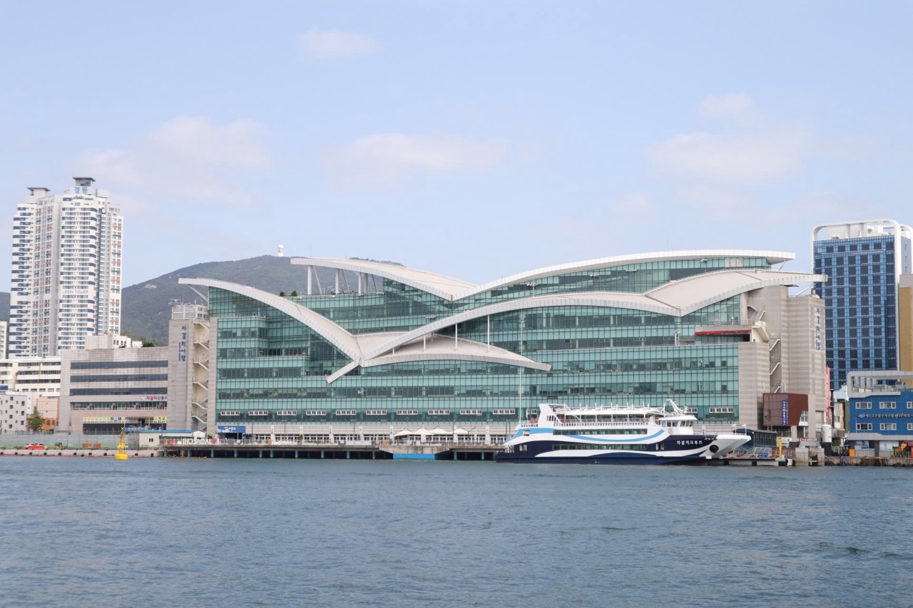 The Jagalchi Fish Market building on the harbor, seen from the water