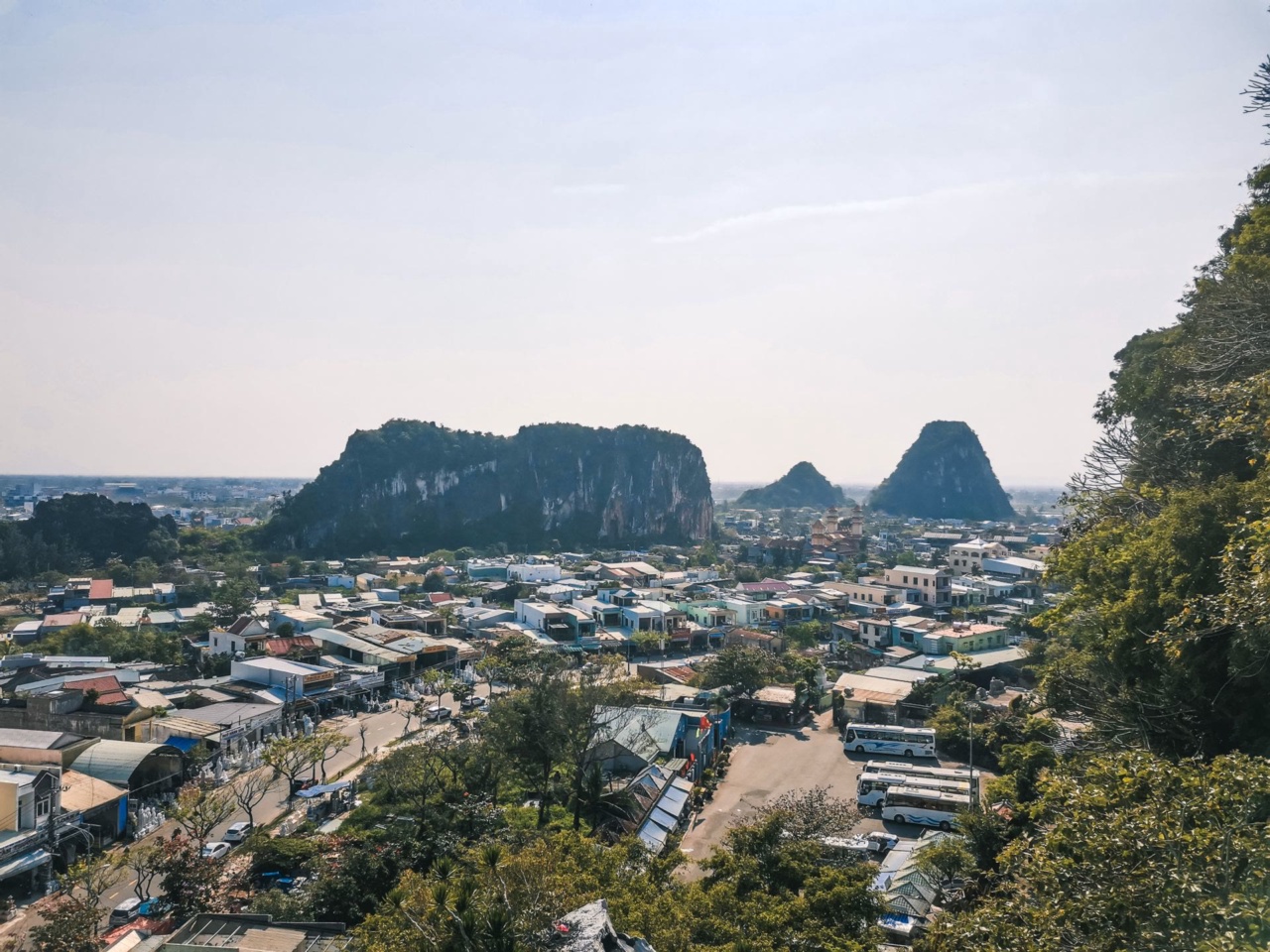 The Marble Mountains rising above the rooftops of Da Nang