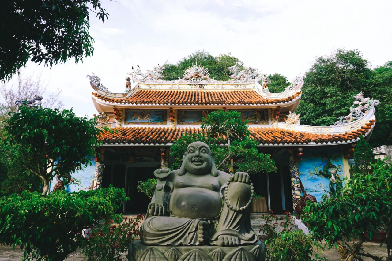 A temple with a seated Buddha statue in the Marble Mountains
