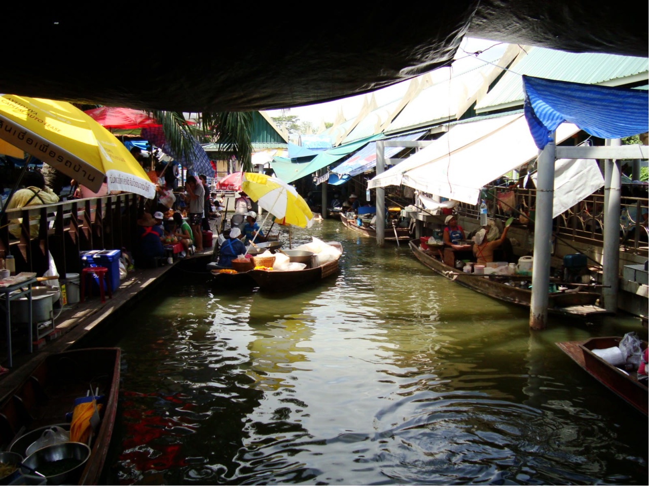 Stalls and boats along the canal at Taling Chan Floating Market
