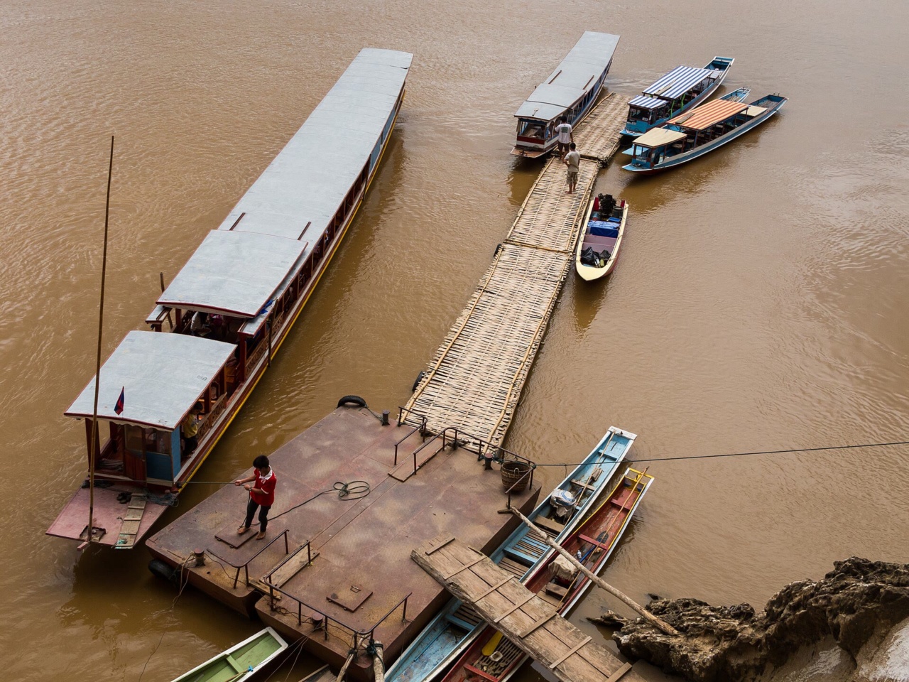 Boats at the jetty below the Pak Ou Caves