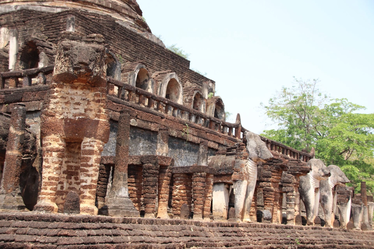 Elephant sculptures around the chedi of Wat Chang Lom in Si Satchanalai Historical Park