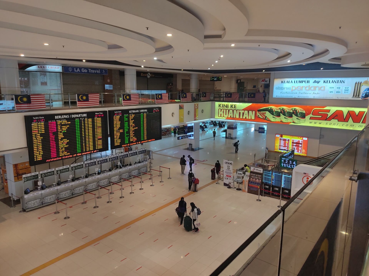 Ticket counters and departure boards in the concourse of Terminal Bersepadu Selatan