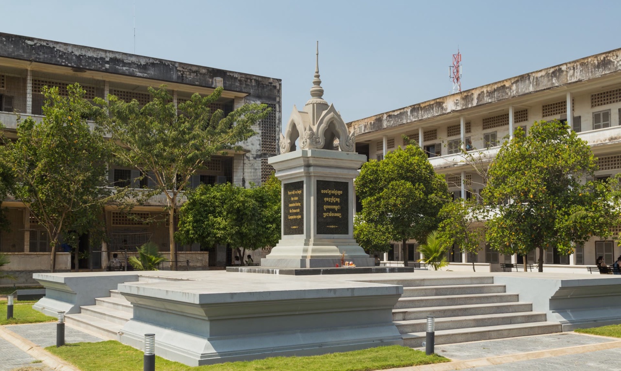 Buildings and a memorial in the grounds of Tuol Sleng Genocide Museum in Phnom Penh